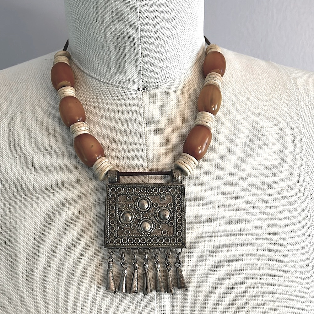 Vintage authentic African tribal necklace with metal center amber colored beads
